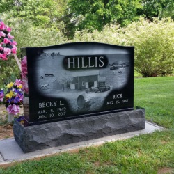 Farm scene etched on a head stone